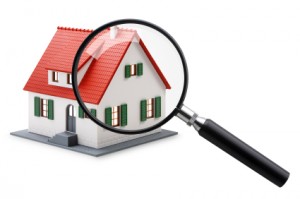 house under a magnifying glass by the home detective